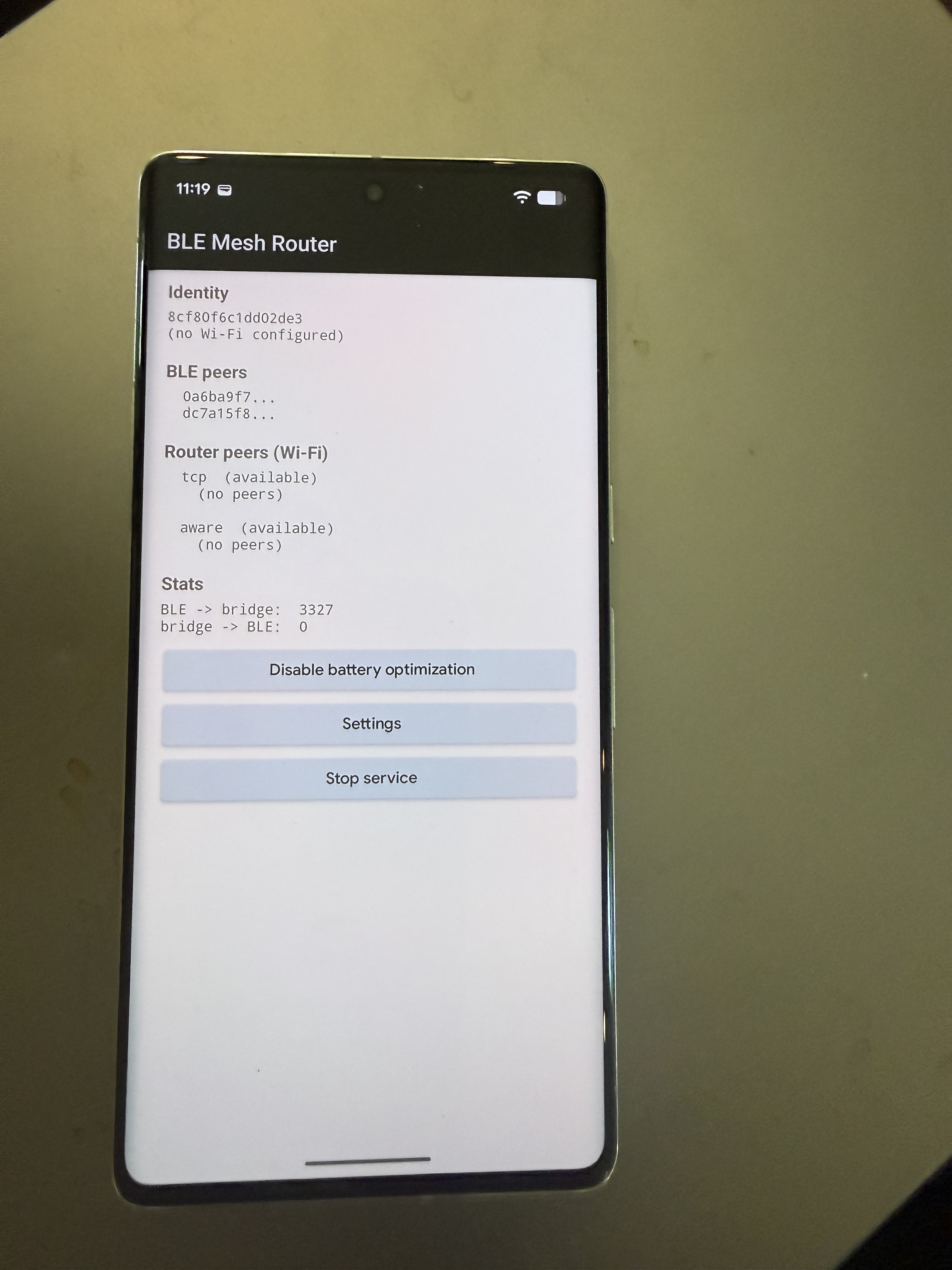 Loxation Mesh Router — a hardened Android device running the BLE Mesh Router service, showing live BLE peers and bridge stats